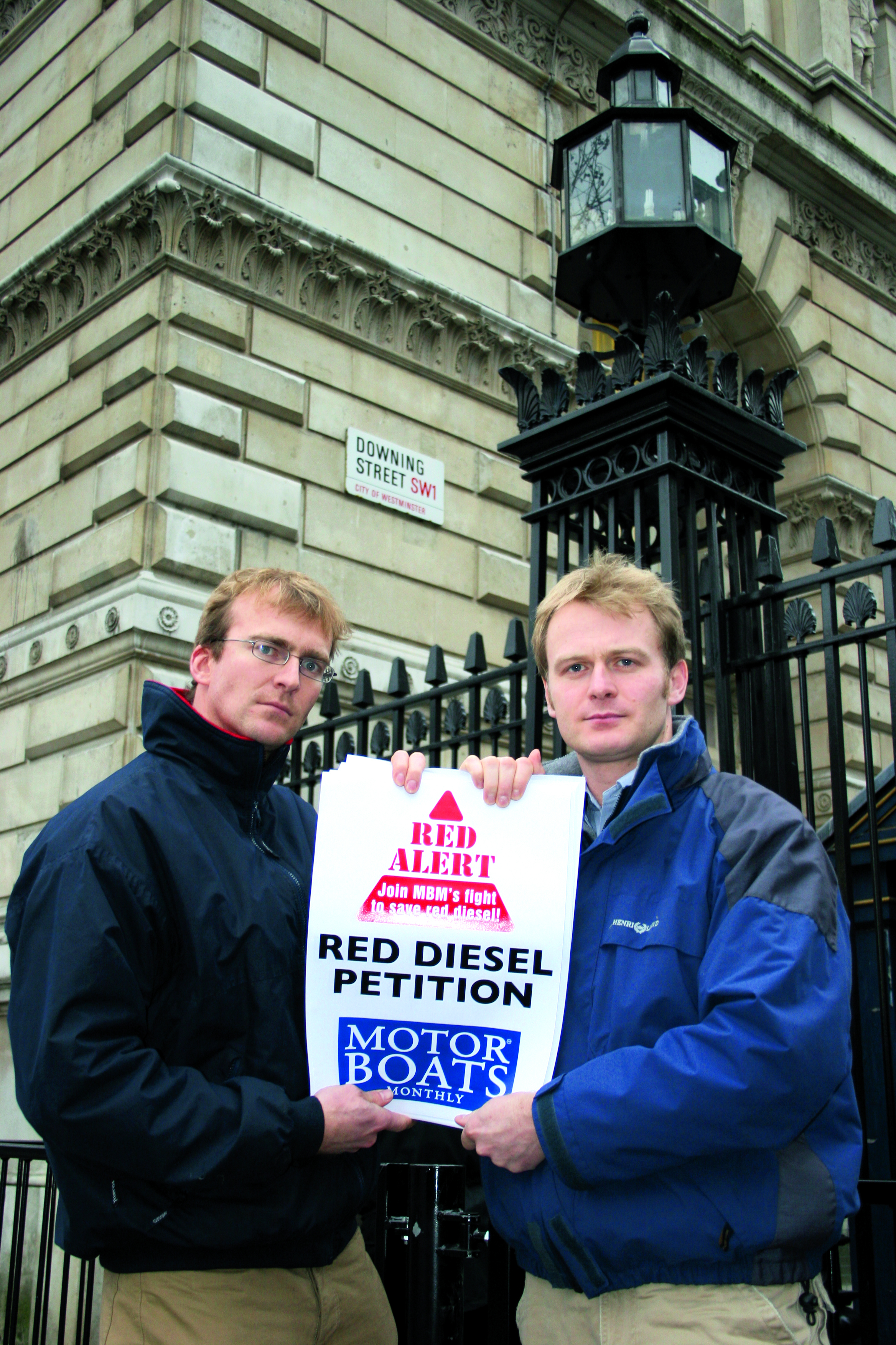 January 2005: Former editor Hugo Andreae and former news editor Rob Peake present MBM's red diesel petition to 10 Downing Street January 2005: Former editor Hugo Andreae and former news editor Rob Peake present MBM's red diesel petition to 10 Downing Street